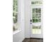 Bright entryway with hardwood floors, a glass-paneled door, and views of the backyard at 15838 Trenton Place Rd, Huntersville, NC 28078