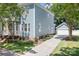 Charming two-story home with blue siding, white trim, landscaped yard, and paved driveway at 15838 Trenton Place Rd, Huntersville, NC 28078