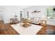 Inviting living room showcases hardwood floors, a neutral color palette, and a cozy seating arrangement at 15838 Trenton Place Rd, Huntersville, NC 28078