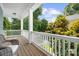 Charming front porch with wicker furniture, offering a relaxing outdoor space with lovely views at 15838 Trenton Place Rd, Huntersville, NC 28078