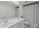 Bright bathroom features double vanity, tub/shower combination, and tile flooring at 169 Rooster Tail Ln, Troutman, NC 28166