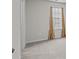 Bedroom with neutral carpeting and a window with tan curtains at 169 Rooster Tail Ln, Troutman, NC 28166