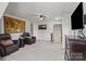 Bonus room with carpet, two leather chairs, and a television at 169 Rooster Tail Ln, Troutman, NC 28166