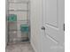 Convenient shelving unit perfect for organized storage, complemented by a clean white door at 169 Rooster Tail Ln, Troutman, NC 28166