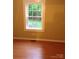 Bright bedroom with new floors, neutral paint, and a window view at 1700 Old Spencer Mountain Rd, Dallas, NC 28034