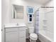 Neat bathroom with a single sink vanity and tub/shower with blue and white striped curtain at 177 Basildon St # 1014, Lancaster, SC 29720