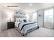 Serene main bedroom with two windows, neutral tones, and two bedside tables with lamps at 177 Basildon St # 1014, Lancaster, SC 29720
