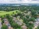 Aerial view of a luxury community on a lush golf course near a lake, showcasing prime real estate at 19205 Hidden Cove Ln, Cornelius, NC 28031