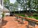 Well maintained back deck with outdoor seating and view of the private backyard and landscaping at 19205 Hidden Cove Ln, Cornelius, NC 28031
