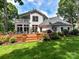 Expansive backyard with a wooden deck, perfect for outdoor entertaining and relaxation in a serene setting at 19205 Hidden Cove Ln, Cornelius, NC 28031