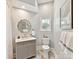 Bright bathroom featuring elegant vanity with marble countertops and stylish decor at 19205 Hidden Cove Ln, Cornelius, NC 28031