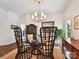 Elegant dining room with unique seating and a stylish chandelier at 19205 Hidden Cove Ln, Cornelius, NC 28031