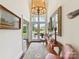 Inviting foyer with high ceilings, chandelier, and double doors leading to the garden at 19205 Hidden Cove Ln, Cornelius, NC 28031