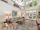 Bright living room with vaulted ceiling, fireplace, French doors, and beautiful decor at 19205 Hidden Cove Ln, Cornelius, NC 28031