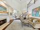 Inviting living room with fireplace, staircase, and elegant furnishings at 19205 Hidden Cove Ln, Cornelius, NC 28031