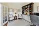 Bright office with custom built-in bookcase, cabinets, and a comfortable workspace at 19205 Hidden Cove Ln, Cornelius, NC 28031