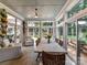 Bright sunroom featuring lots of natural light, comfortable seating, and peaceful views at 19205 Hidden Cove Ln, Cornelius, NC 28031