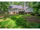The backyard with a partial view of the home's rear exterior at 203 Hickory Wood Dr, Kannapolis, NC 28083