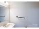 Modest bathroom with white walls, a vanity, and basic fixtures at 203 Hickory Wood Dr, Kannapolis, NC 28083