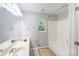 Bathroom featuring a double sink vanity, a shower and tub combination, and a window at 203 Hickory Wood Dr, Kannapolis, NC 28083