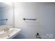 Simple bathroom with a wall-mounted towel bar, toilet paper holder, and a plain toilet at 203 Hickory Wood Dr, Kannapolis, NC 28083