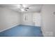 Standard bedroom featuring an overhead fan, windows, and an access door at 203 Hickory Wood Dr, Kannapolis, NC 28083