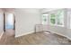 Dining space featuring hardwood floors and a bay window with natural light at 203 Hickory Wood Dr, Kannapolis, NC 28083