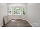 Bright dining room with updated floors and large bay window at 203 Hickory Wood Dr, Kannapolis, NC 28083