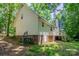 Exterior view of the home with siding, brick foundation, and a well-manicured lawn at 203 Hickory Wood Dr, Kannapolis, NC 28083