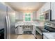 Modern kitchen featuring granite countertops and stainless steel appliances at 203 Hickory Wood Dr, Kannapolis, NC 28083
