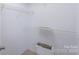 Walk-in closet with wire shelving and open area for a toilet at 203 Hickory Wood Dr, Kannapolis, NC 28083