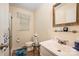 Bathroom featuring a vanity with a sink, mirror, toilet, window and shower at 2109 Quail Nw Dr, Concord, NC 28027