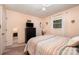 Comfortable bedroom with neutral tones, a ceiling fan, and natural light at 2109 Quail Nw Dr, Concord, NC 28027
