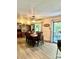 Spacious dining room featuring a large wooden table, ample seating, built-in shelving, and natural light from sliding glass doors at 2109 Quail Nw Dr, Concord, NC 28027
