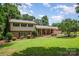 Charming two-story home with brick accents, mature landscaping, and a covered porch in a beautiful, serene setting at 2109 Quail Nw Dr, Concord, NC 28027