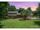 Charming two-story home with brick accents, mature landscaping, and a two-car garage in a beautiful, serene setting at 2109 Quail Nw Dr, Concord, NC 28027