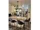 Bright kitchen with light countertops, a breakfast bar with seating, stainless steel appliances, and ample counter space at 2109 Quail Nw Dr, Concord, NC 28027