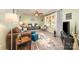 Inviting living room featuring neutral walls, a ceiling fan, comfortable seating, and a large window with a view at 2109 Quail Nw Dr, Concord, NC 28027