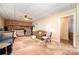 Large living area featuring a brick fireplace, plush seating, and doorway to an adjacent room at 2109 Quail Nw Dr, Concord, NC 28027