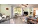 Cozy living room featuring a large window, ceiling fan, comfortable seating, and stylish decor for relaxation at 2109 Quail Nw Dr, Concord, NC 28027