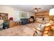Spacious living room featuring a brick fireplace, large window, comfortable seating and ceiling fan at 2109 Quail Nw Dr, Concord, NC 28027