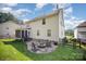 Lovely backyard featuring brick patio with fire pit and screened-in porch, perfect for outdoor entertaining at 220 Holmes Ct, Concord, NC 28027