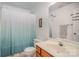 Clean bathroom with a shower/tub combo and a vanity sink at 220 Holmes Ct, Concord, NC 28027