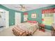 Green bedroom with double windows, neutral carpet, ceiling fan, and a matching bedside table at 220 Holmes Ct, Concord, NC 28027
