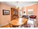 View of a dining area with a wooden table and chairs, hardwood floors, and natural light at 220 Holmes Ct, Concord, NC 28027