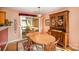 Cozy dining room featuring wood table, china cabinet, and view to screened-in porch at 220 Holmes Ct, Concord, NC 28027