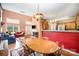 Open-concept dining area with wooden table set, adjacent to the living room and kitchen at 220 Holmes Ct, Concord, NC 28027