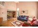 Open-concept living room featuring hardwood floors, large windows, and comfortable seating and decor at 220 Holmes Ct, Concord, NC 28027