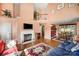 Bright living room with fireplace, hardwood floors, and a dining area, creating an inviting atmosphere at 220 Holmes Ct, Concord, NC 28027