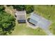 Aerial view of a home with a deck, a well-manicured yard, and detached garage at 220 Plonk Rd, Dallas, NC 28034
